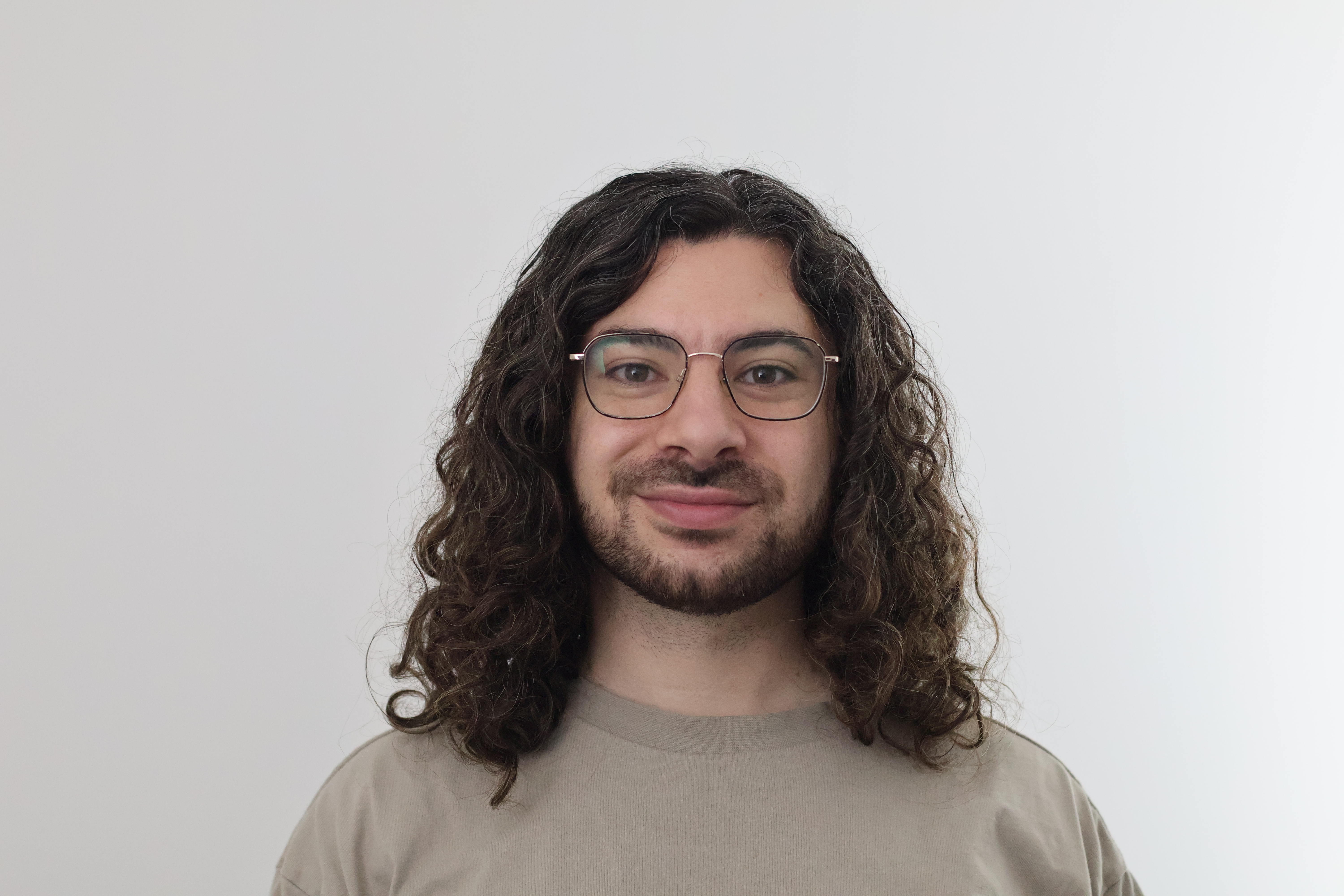 Adam C Younis Headshot Glasses